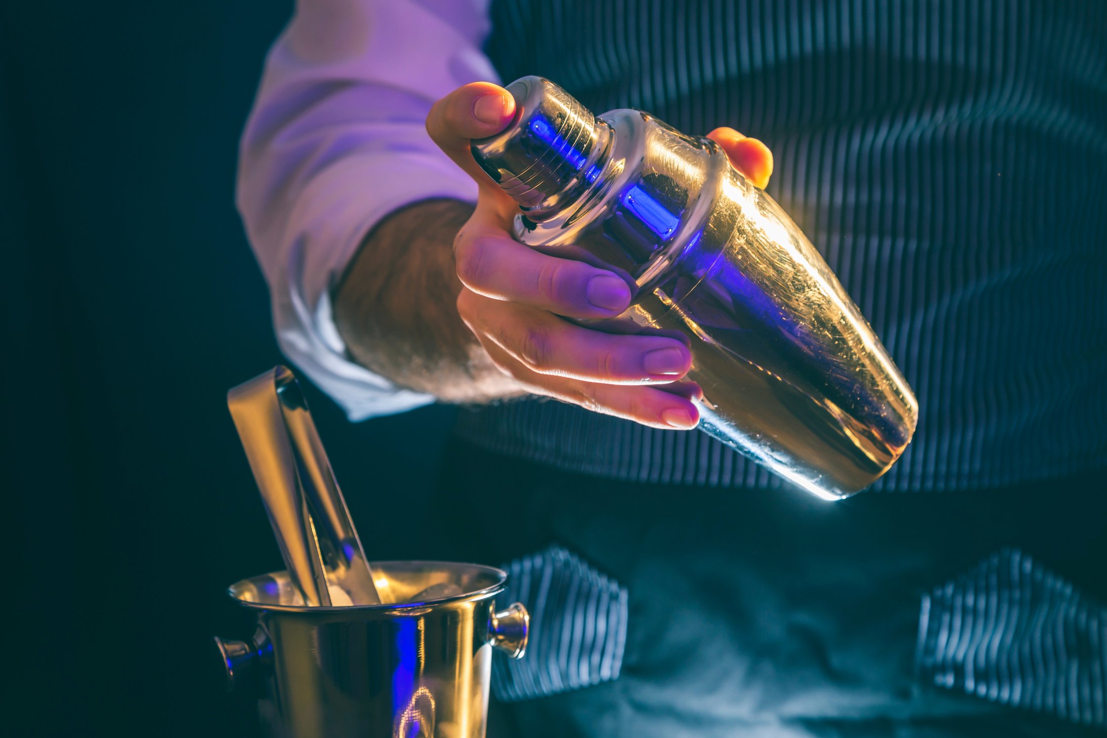 Bartender using cocktail shaker